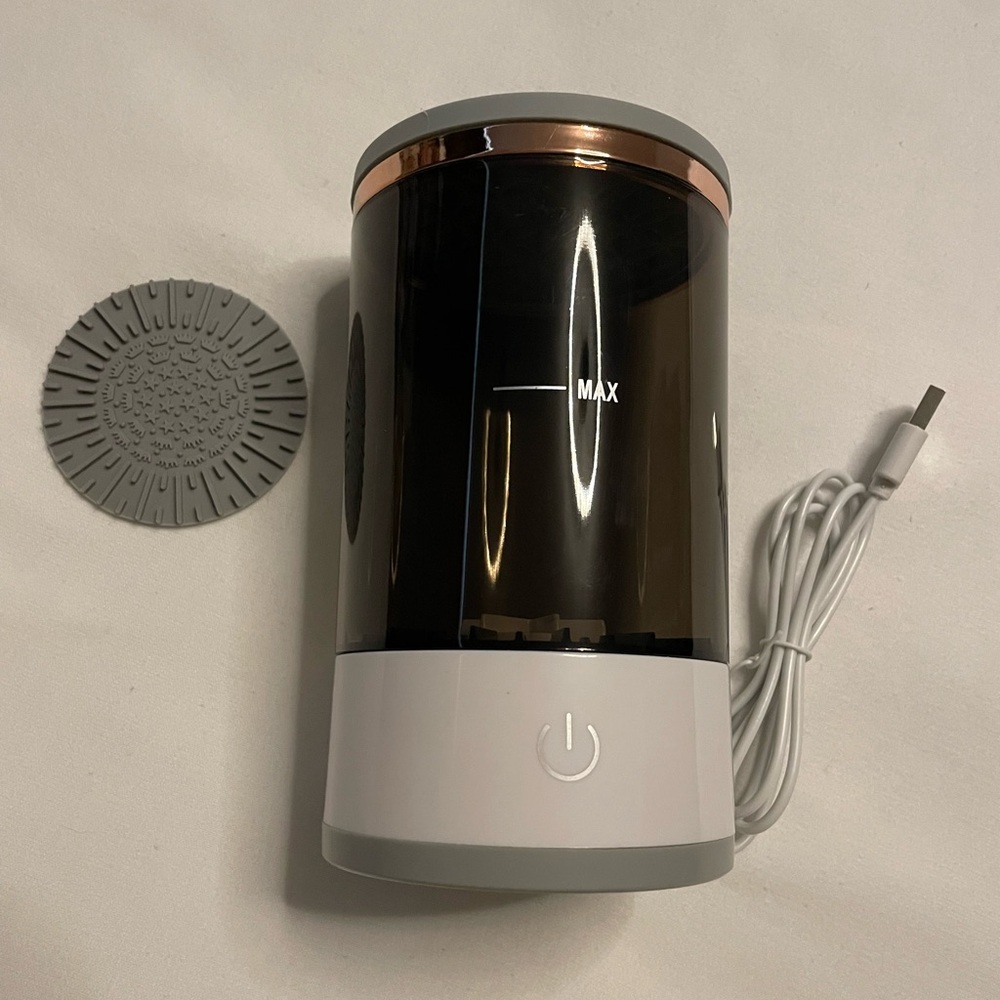 New, Never used. Makeup brush cleaner. Comes with box.